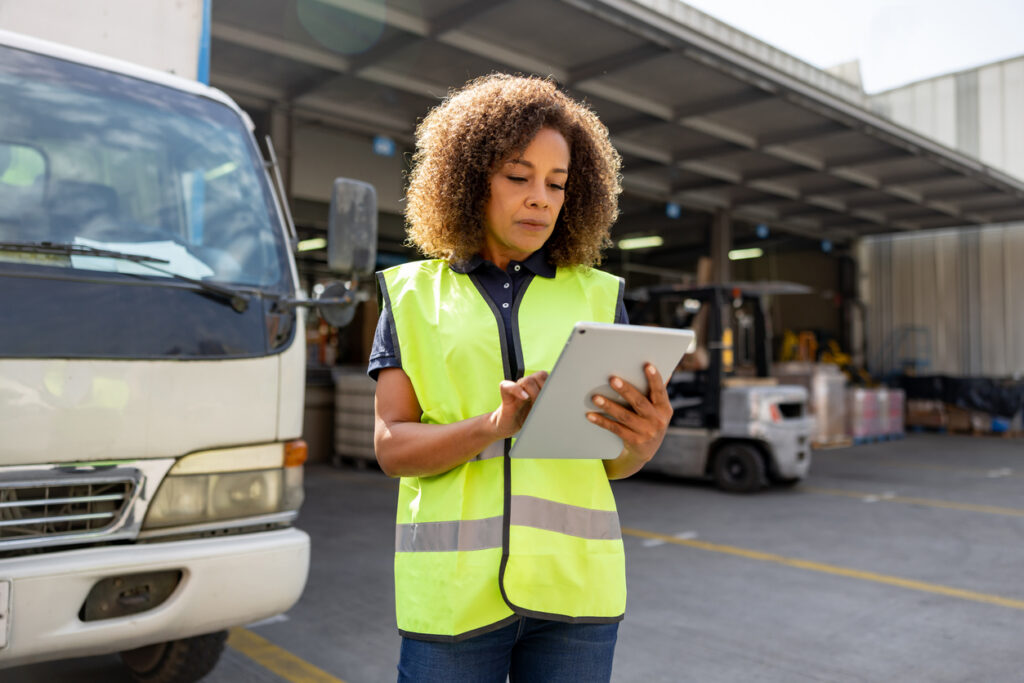 Australian tradesperson auditing job site margins and software expenses on a mobile device to stop profit leaks.